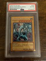 Front of YuGiOh Blue-Eyes White Dragon card BPT-009 inside PSA protective slab graded 6