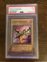 Front of the YuGiOh Curse of Dragon PSA 5 graded card in plastic slab showing card details and grade label.