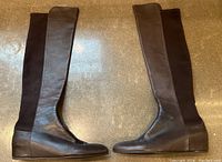 Side view of both boots showing leather front and stretch back panels