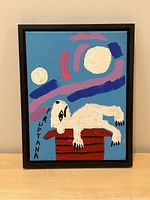 Front view of framed acrylic painting showing full composition of abstract animal scene