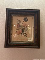 Framed floral print with dark wooden frame and gold inner border, showing overall lot
