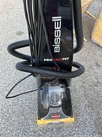 Front view of Bissell ProHeat Pet upright vacuum cleaner with the Bissell logo and model name visible.