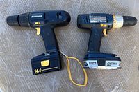 Mastercraft 14.4V and Ryobi 18V cordless drills showing side-by-side with batteries attached