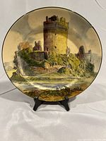 Photo of full plate showing front image of Pembroke Castle, 10.5 inches in diameter, glazed surface with castle scene.