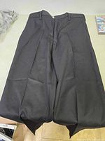 Two black Cintas Comfort Flex pants laid flat to show overall design and fabric.