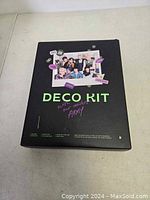 Black box of BTS Deco Kit with group photo and member names on the front