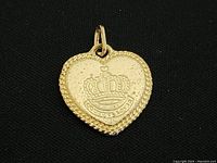 Front view of gold-tone heart locket with detailed crown and text 'Forever Love' under the crown, highlighting textured border and attachment loop.