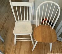 Two wooden chairs, one painted white with wear, one with natural wood seat and white painted back and legs