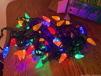 Multicolor LED light strand lit up showing red, green, blue, and orange bulbs.