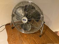 Front view showing chrome metal blade housing and 'Super' logo in center.