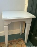 Small gray painted wooden table with minor wear on top.