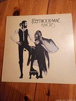 Front cover of Fleetwood Mac Rumours vinyl album showing black and white image of band members.