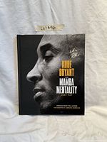 Front cover photo of The Mamba Mentality book featuring Kobe Bryant's profile.