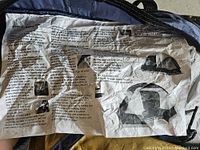 Folded setup instructions inside the tent's carry bag, showing steps and diagrams for pitching the tent.