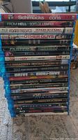 Stack of 22 Blu-ray movie cases showing titles from various genres