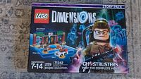 Front view of the Lego Dimensions Ghostbusters Story Pack 71242 retail box showing build pieces count and main character minifigure image.