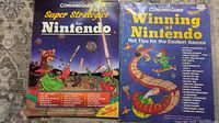 Two Nintendo strategy guides side by side; "Super Strategies for Nintendo" and "Winning at Nintendo Hot Tips for the Coolest Games" with illustrated covers.
