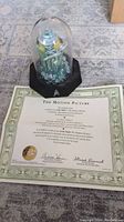Limited edition Star Trek sculpture in glass dome with certificate beneath it, showing the sculpture details and base with the Star Trek delta symbol