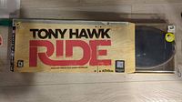 Original Tony Hawk Ride box for PlayStation 3 skateboard controller with branding and game title visible.