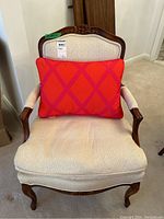 Front view of Barrymore armchair showing upholstery with attached throw cushion