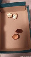 Pair of oval ribbed stripe cufflinks in box