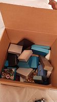 Box of assorted jewelry and small presentation boxes
