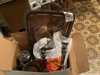 Box filled with assorted silver plated hostess ware including candle sticks and a large square tray