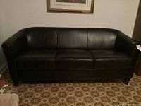 Front view of dark brown bonded leather sofa