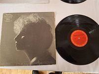 Vinyl LP record and corresponding album cover laid flat showing the disc's surface and cover artwork.