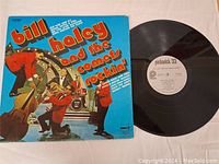 Vinyl LP record removed from its sleeve showing label and vinyl condition.