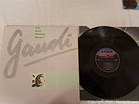 The Alan Parsons Project Gaudi vinyl LP sleeve and record with Arista label visible on disc