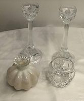 Photo showing two clear glass candlesticks, a white milk glass vase with fluted clear rim, and the Royal Doulton cut glass dish.