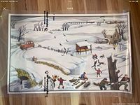 Photo showing the winter side of the double-sided poster depicting ice skating children, snowy landscape, and woodcutting.