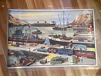 Photo of one side of the poster showing a harbor/port scene with ships, cranes, trucks, and a train
