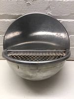 Front view of stainless steel wall-mount commercial ashtray with mesh grate.