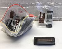 Lot of 10 drawer pulls in bags with one pull outside the bag for size and detail view