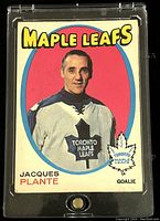 Front of 1971-72 O-Pee-Chee Jacques Plante Toronto Maple Leafs hockey card showing player portrait and team logo.