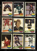 Nine 1980-81 O-Pee-Chee NHL player trading cards displayed in a folder plastic sleeve. Cards feature various players from different NHL teams including Rangers, Whalers, Oilers, Red Wings, Penguins, Bruins, Blackhawks, Kings, and North Stars.
