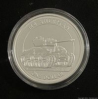 Obverse side showing M4 Sherman tank and denomination