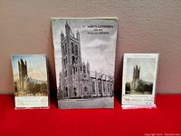 Photo showing the full lot: a 1973 booklet and two antique postcards of St. Mary's Cathedral in Kingston, Ontario, displayed against a red background.