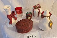 Top front view showing all 7 decorative items arranged on a white cloth background.