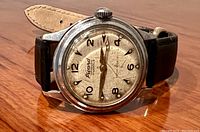 Photo of the front of the vintage Picard automatic wristwatch showing the dial, hands, and leather strap.