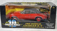 Boxed limited edition 1968 Dodge Charger R/T die cast model by Ertl American Muscle series, front and side view showing red body with black roof in display box marked 1 of 2,502.