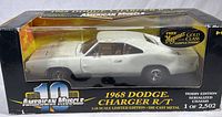 White 1968 Dodge Charger R/T 1:18 die cast model car in original packaging, showing front and right side of car through clear plastic window of box with American Muscle branding.
