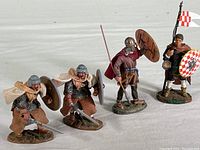 All four Del Prado medieval warrior figures arranged in a row showing various poses and armaments.