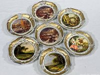 View showing all seven plastic coasters with Italian scenic decorations in various colors and themes.