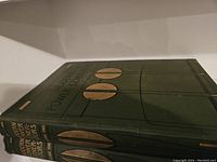 Two hardcover books titled 'Modern Power Generators' with decorative circular elements and gold text on spine and cover, volumes one and two shown stacked horizontally.