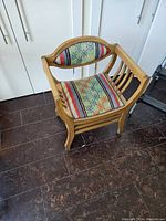 View of the hornbeam wood chair with Turkish Kilim upholstery, showing the overall design, wooden frame, and vibrant rug fabric on the seat and backrest.