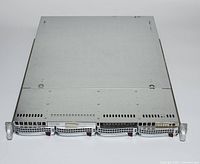 Top view of the closed rack server chassis showing the metallic body with ventilation grilles and handle latches on front.