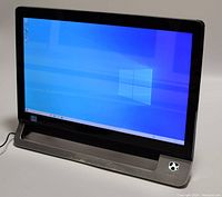 Front view of the Gateway All-in-One PC powered on, displaying Windows desktop on touchscreen, showing black bezel and Gateway logo on bottom right.